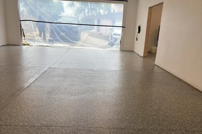 Garage with Glass Door — Penntek polyurea flake system installed by Three Stone in Middle Tennessee