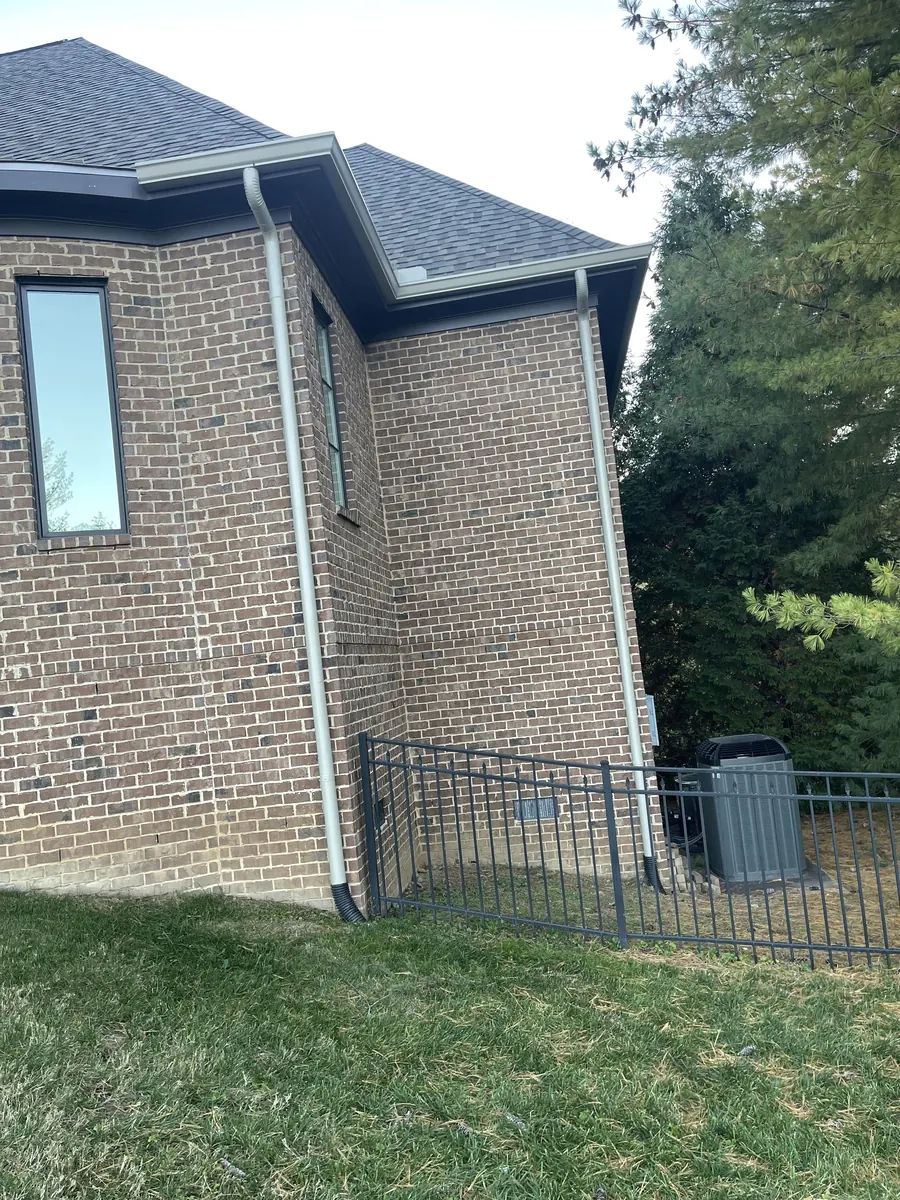 Full-Round Downspouts — 6" K-style seamless aluminum gutters with full-round downspouts by Three Stone in Middle Tennessee