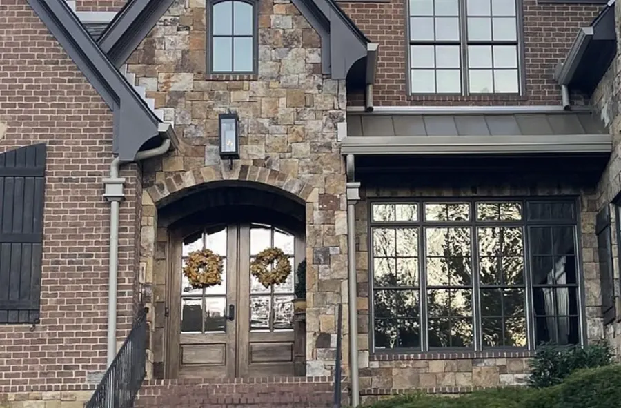 Full-Round Downspouts — 6" K-style seamless aluminum gutters with full-round downspouts by Three Stone in Middle Tennessee