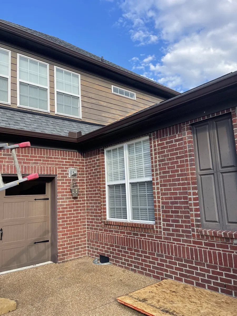 Red Brick Home, Spectra K-Style — Spectra Metals 6" K-style gutters and downspouts by Three Stone in Middle Tennessee