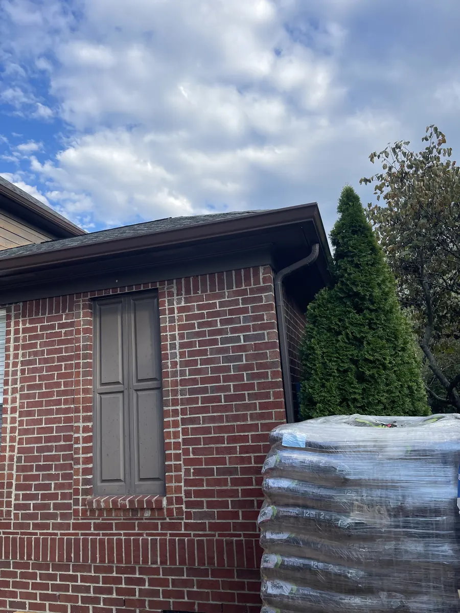 Red Brick Home, Spectra K-Style — Spectra Metals 6" K-style gutters and downspouts by Three Stone in Middle Tennessee