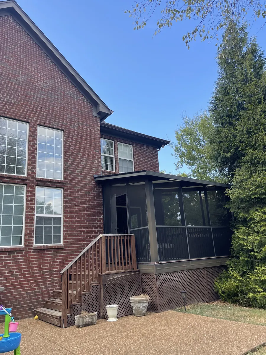 Red Brick Home, Spectra K-Style — Spectra Metals 6" K-style gutters and downspouts by Three Stone in Middle Tennessee