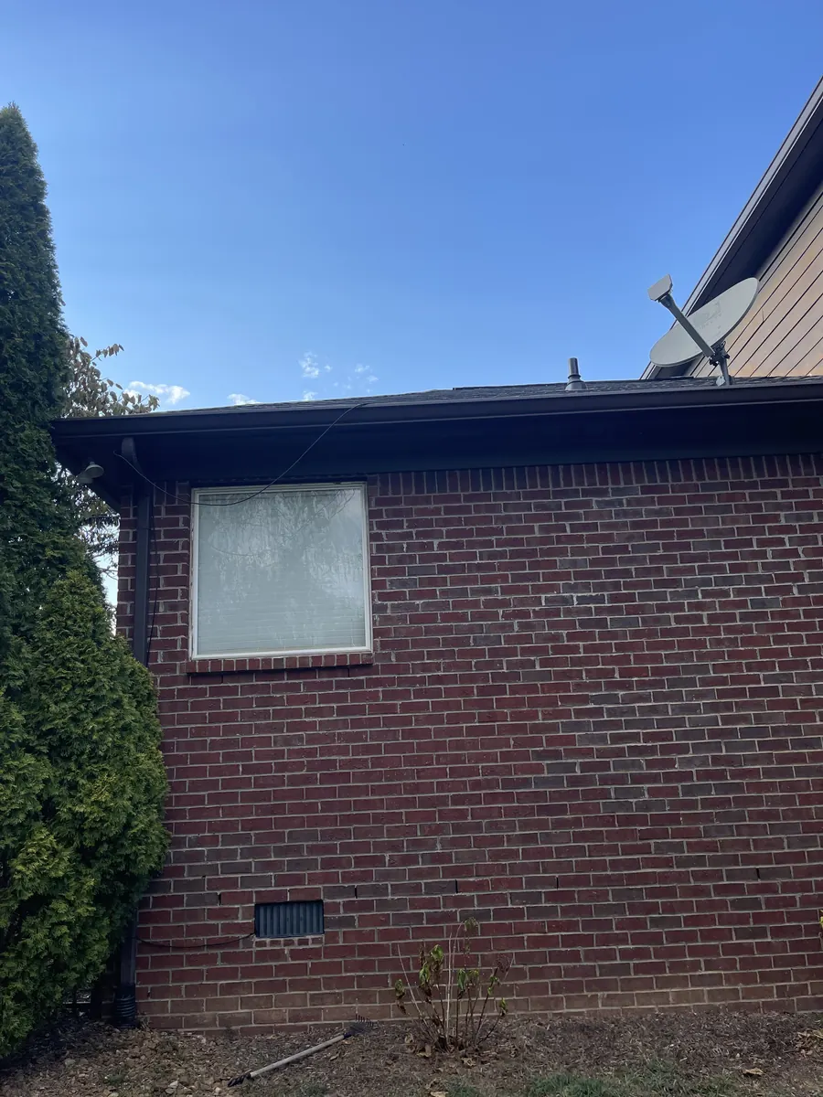 Red Brick Home, Spectra K-Style — Spectra Metals 6" K-style gutters and downspouts by Three Stone in Middle Tennessee