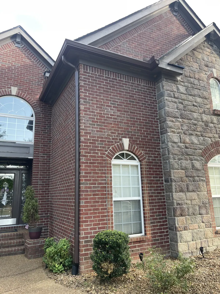Red Brick Home, Spectra K-Style — Spectra Metals 6" K-style gutters and downspouts by Three Stone in Middle Tennessee