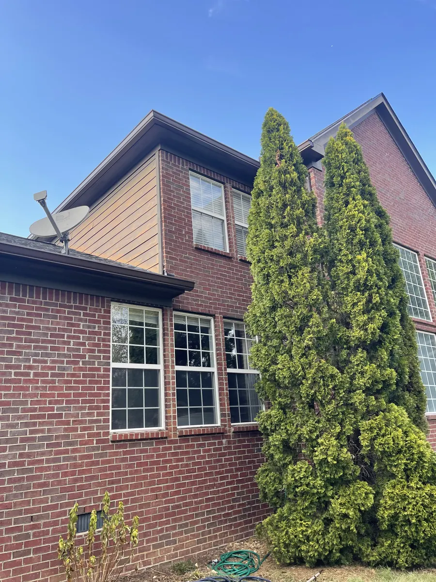 Red Brick Home, Spectra K-Style — Spectra Metals 6" K-style gutters and downspouts by Three Stone in Middle Tennessee