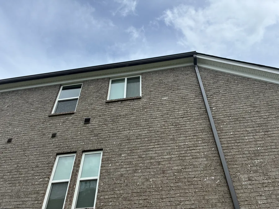 Tan Brick Home, Spectra K-Style — Spectra Metals 6" K-style gutters and downspouts by Three Stone in Middle Tennessee