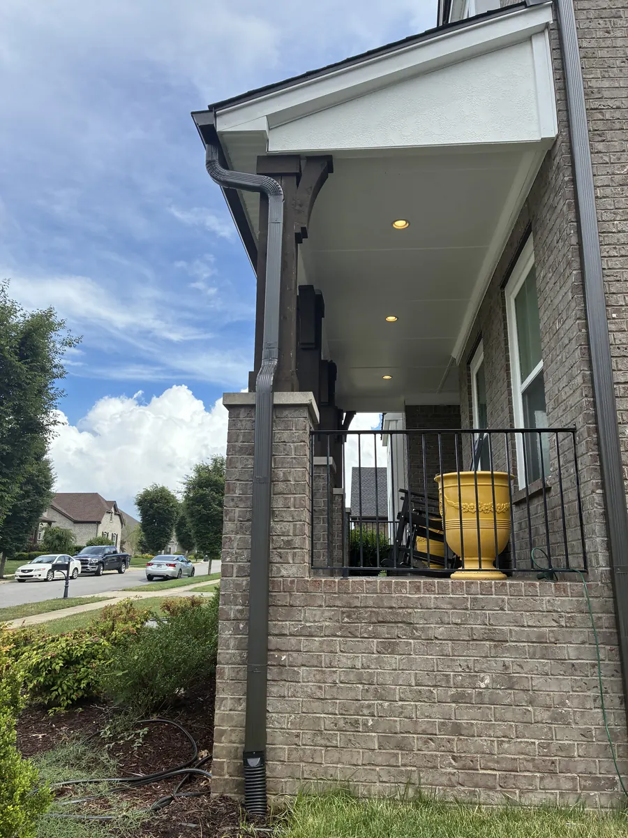 Tan Brick Home, Spectra K-Style — Spectra Metals 6" K-style gutters and downspouts by Three Stone in Middle Tennessee
