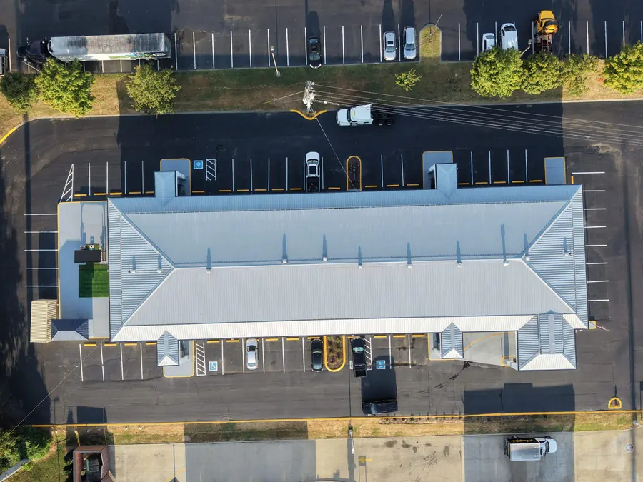 Econo Lodge — R-panel metal roof replacement roof by Three Stone in Middle Tennessee