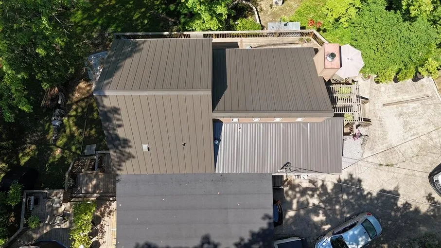 Three Stone Commercial Roofing — a metal roof retrofitted with TPO