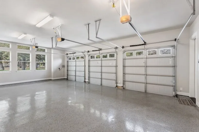 Commercial shop floor with a heavy-traffic polyurea coating installed by Three Stone