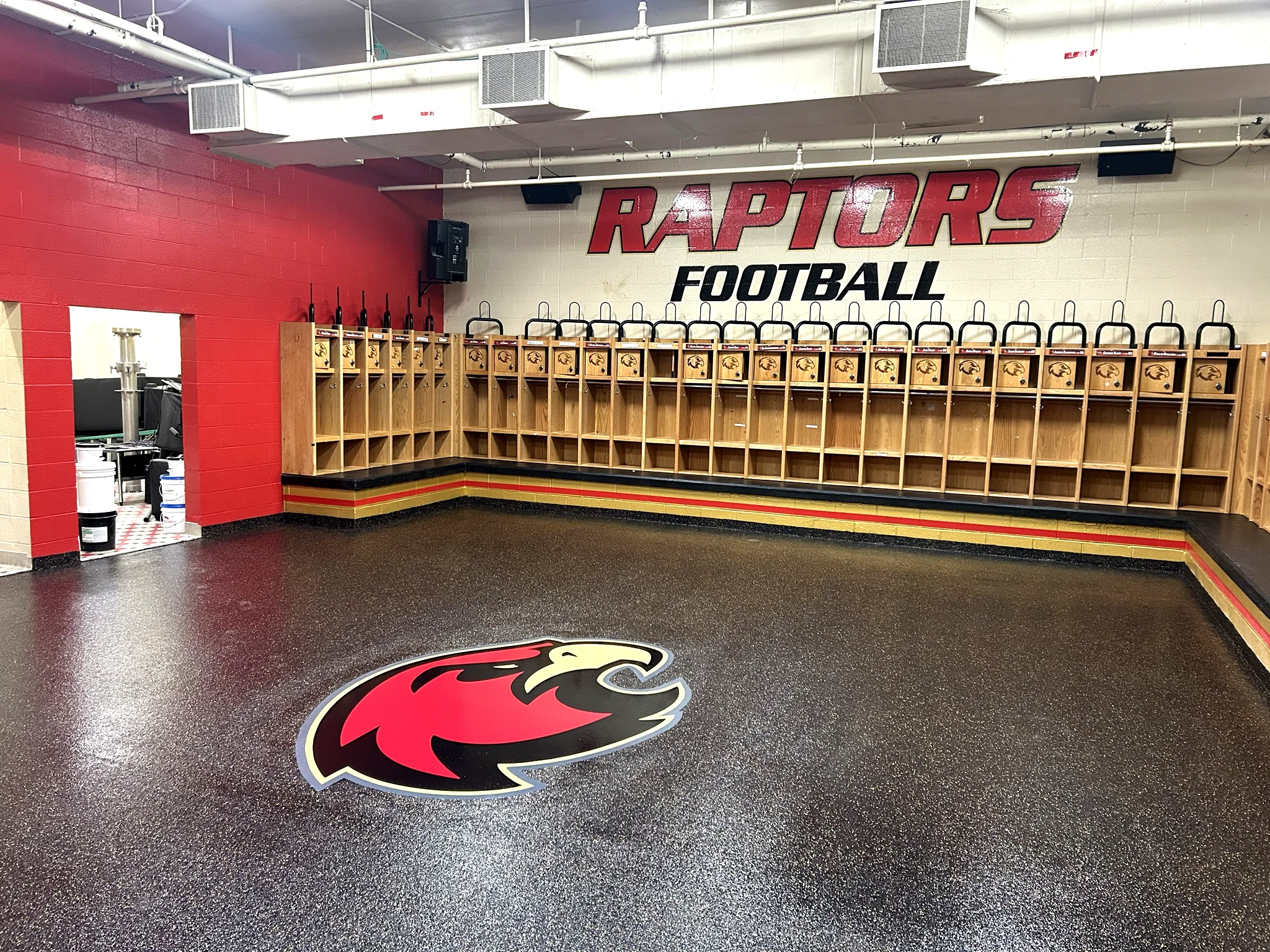 Ravenwood High School Raptors football locker room with a Penntek flake floor installed by Three Stone