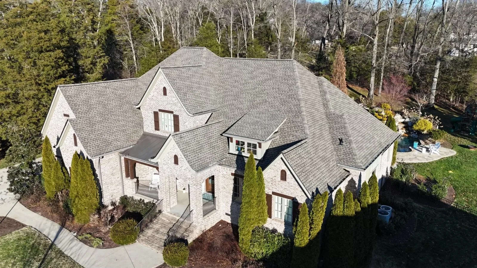Stone home in Brentwood, TN with a completed Three Stone roof replacement