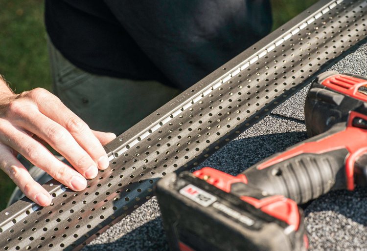 Close up of GutterRX gutter product being installed