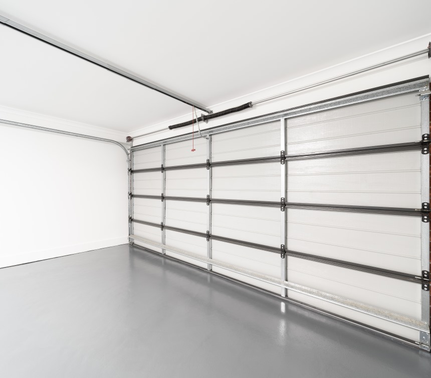 Residential garage floor with new sleek concrete coated floor
